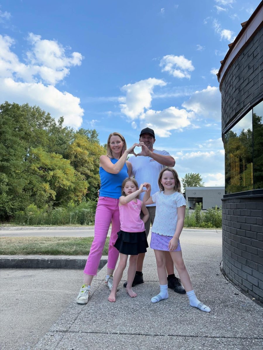 Kay Anderson, founder of Prana Play, with her family outside the Carmel, Indiana sensory playground